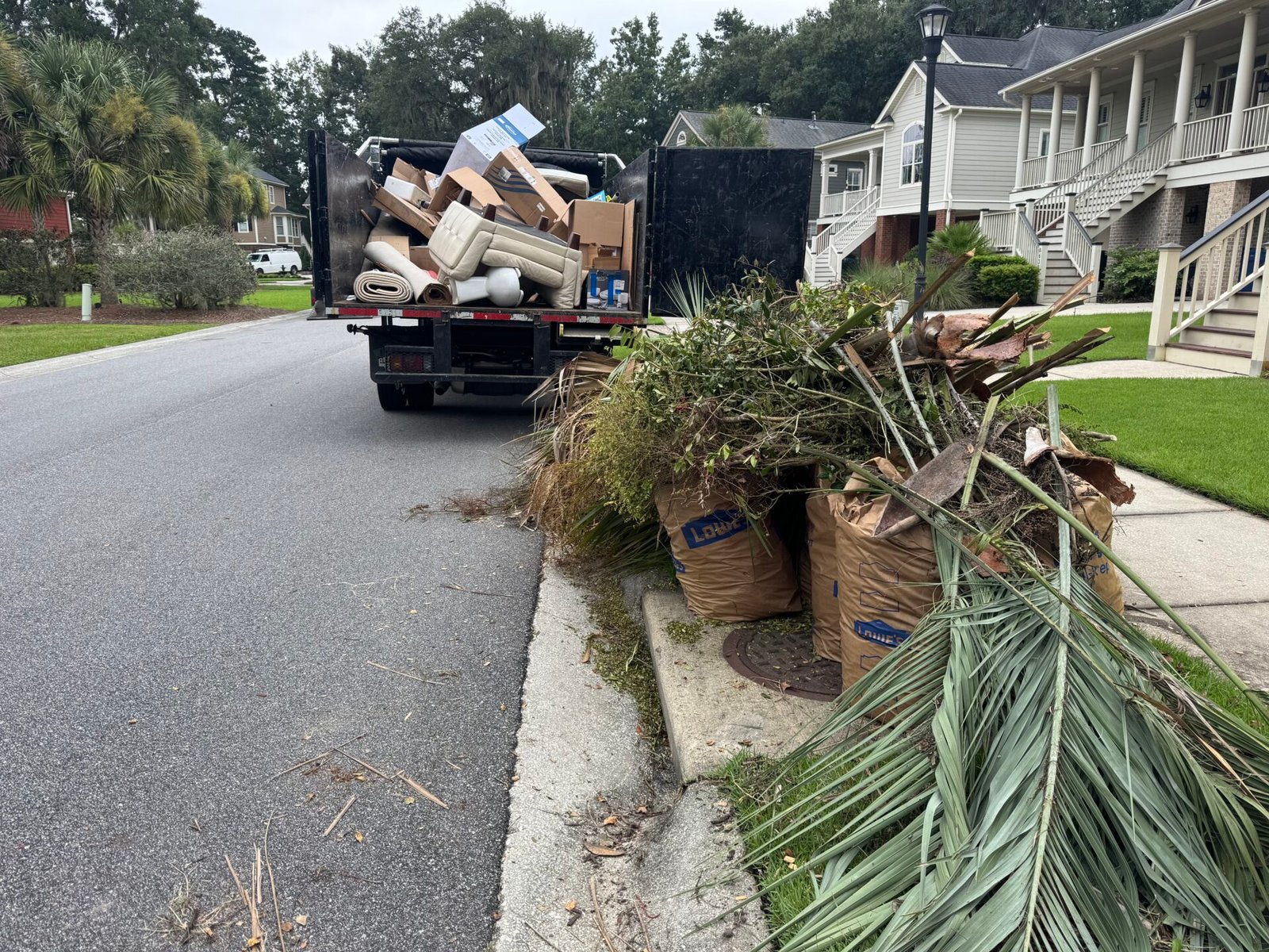 Black Dog Junk Removal picking up curbside yard debris and household junk in Mount Pleasant SC