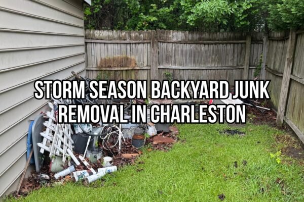 Backyard clutter and debris piled near a fence and house before storm season yard junk removal in Charleston.