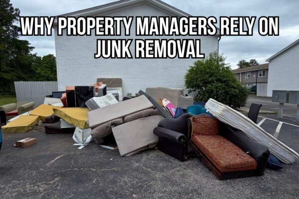 Large pile of discarded furniture, mattresses, couches, cushions, and household junk from an apartment cleanout staged outside a residential property. Overlay text reads, "Why Property Managers Rely on Junk Removal," highlighting the importance of professional junk removal services for apartment turnovers and property management.